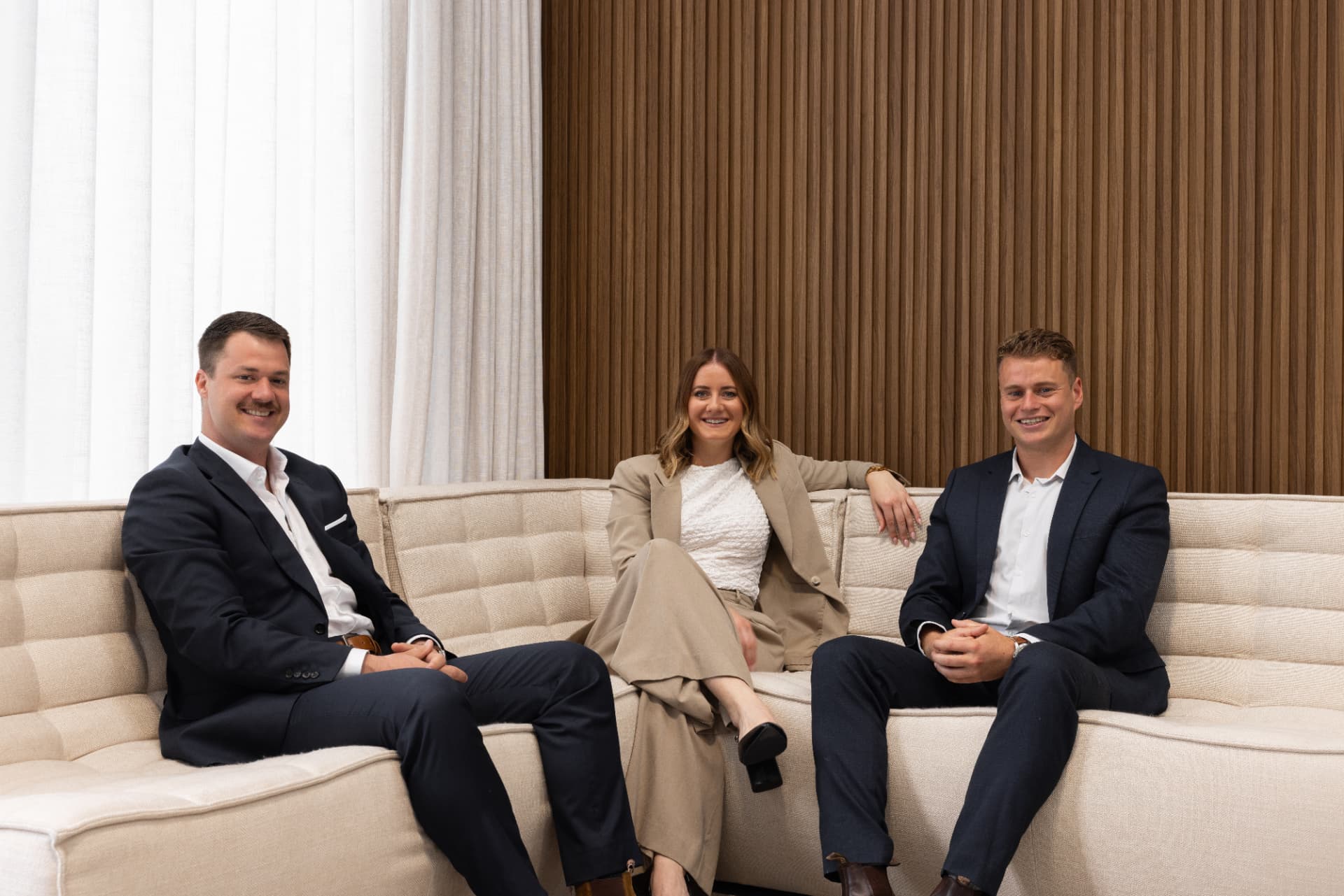 The McKenzie | Parker & Co team seated in their Mount Maunganui office
